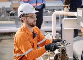 A chemical engineer, working at an operation plant. 